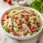 Savory BLT chicken salad with chicken, bacon, lettuce, and tomato in a bowl